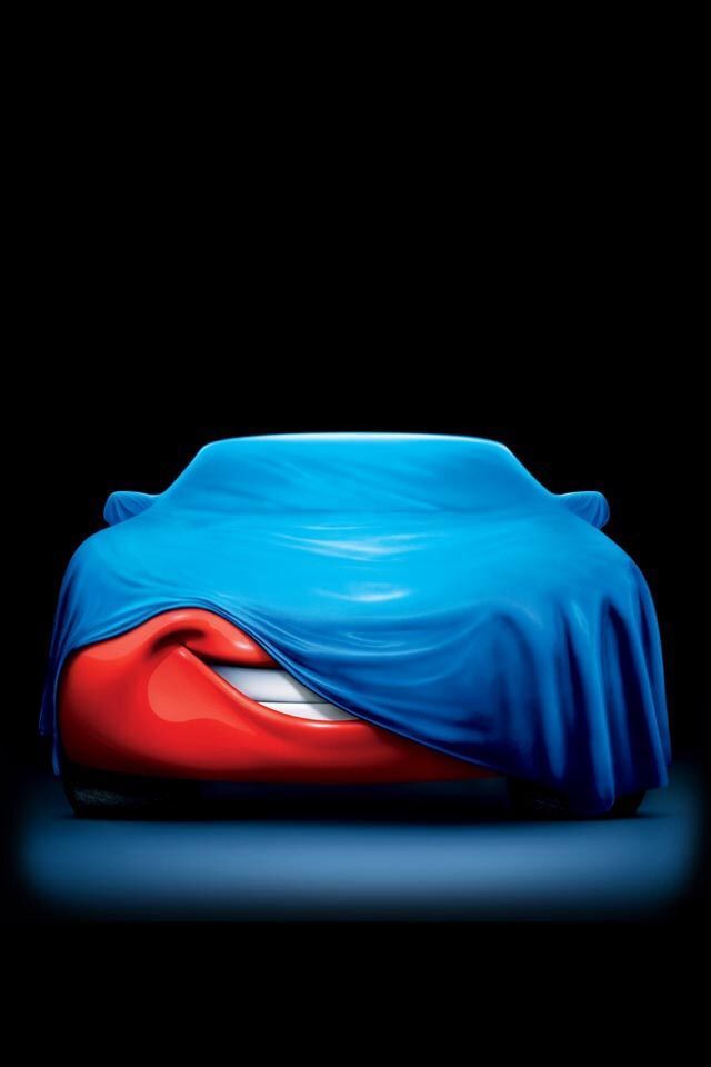 Red car is covered by blue sheet ready for next part